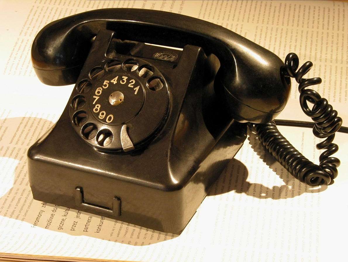 Old black telephone with a dial puzzle online from photo