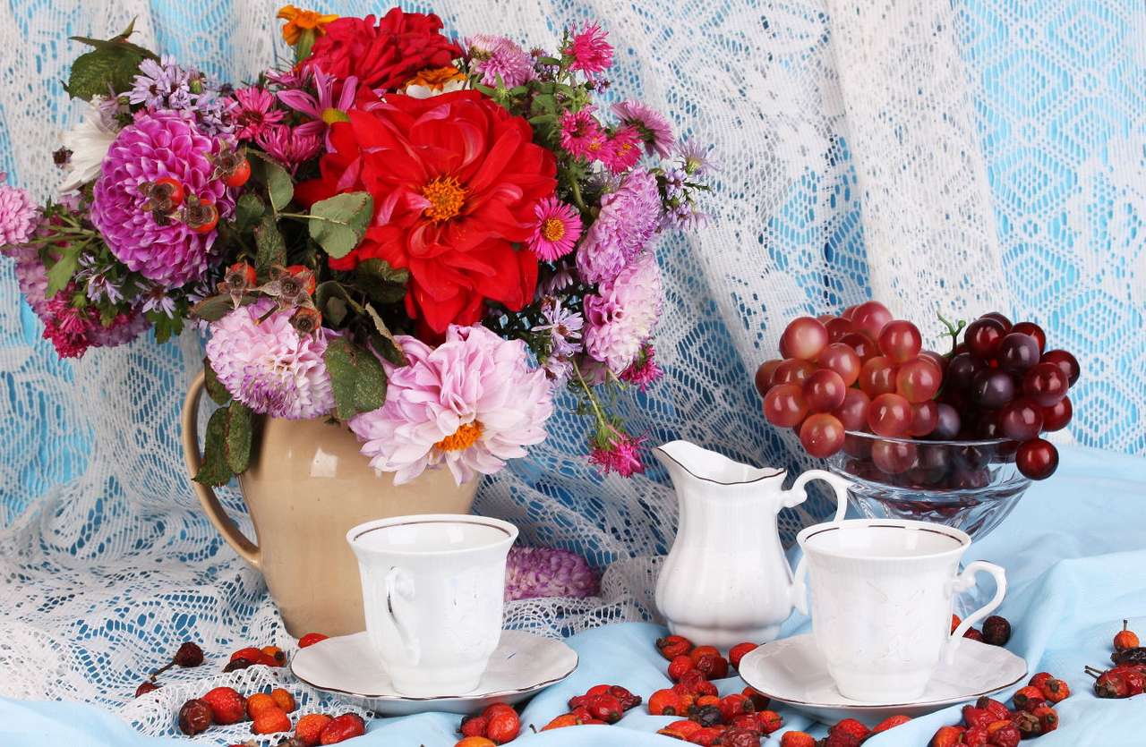 Still life depicting a bouquet of flowers and cups puzzle online from photo