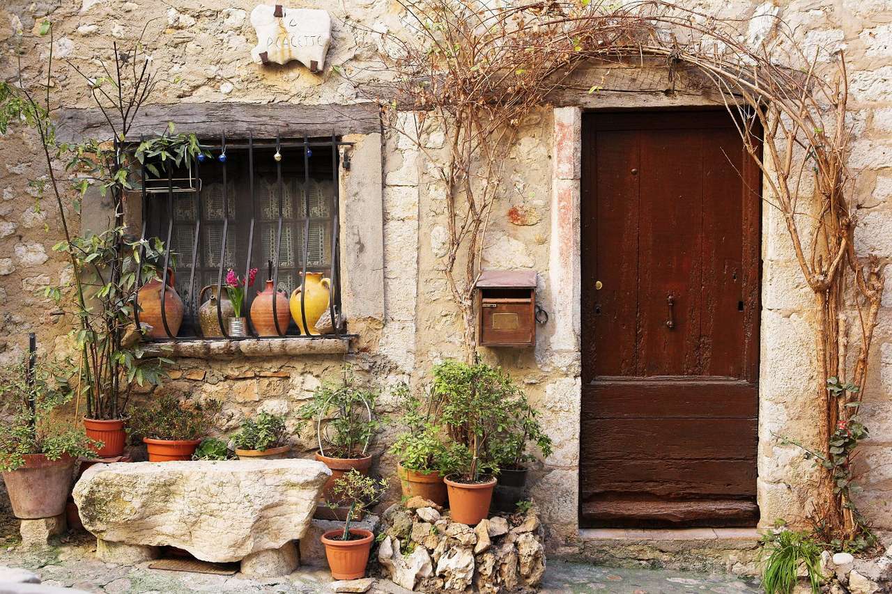 Flower pots in front of a house in Saint-Paul de Vence (France) puzzle online from photo