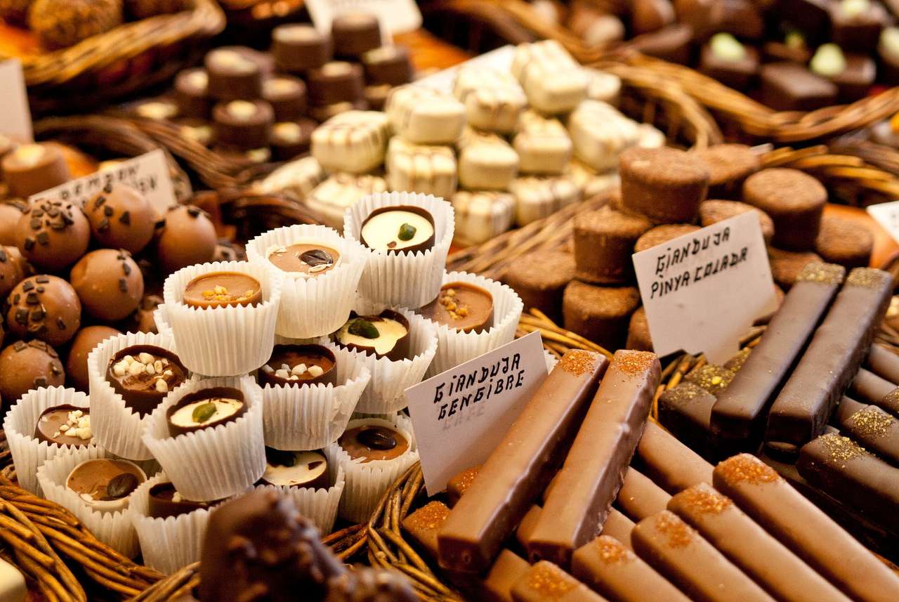 Chocolate products arranged in rows puzzle online from photo