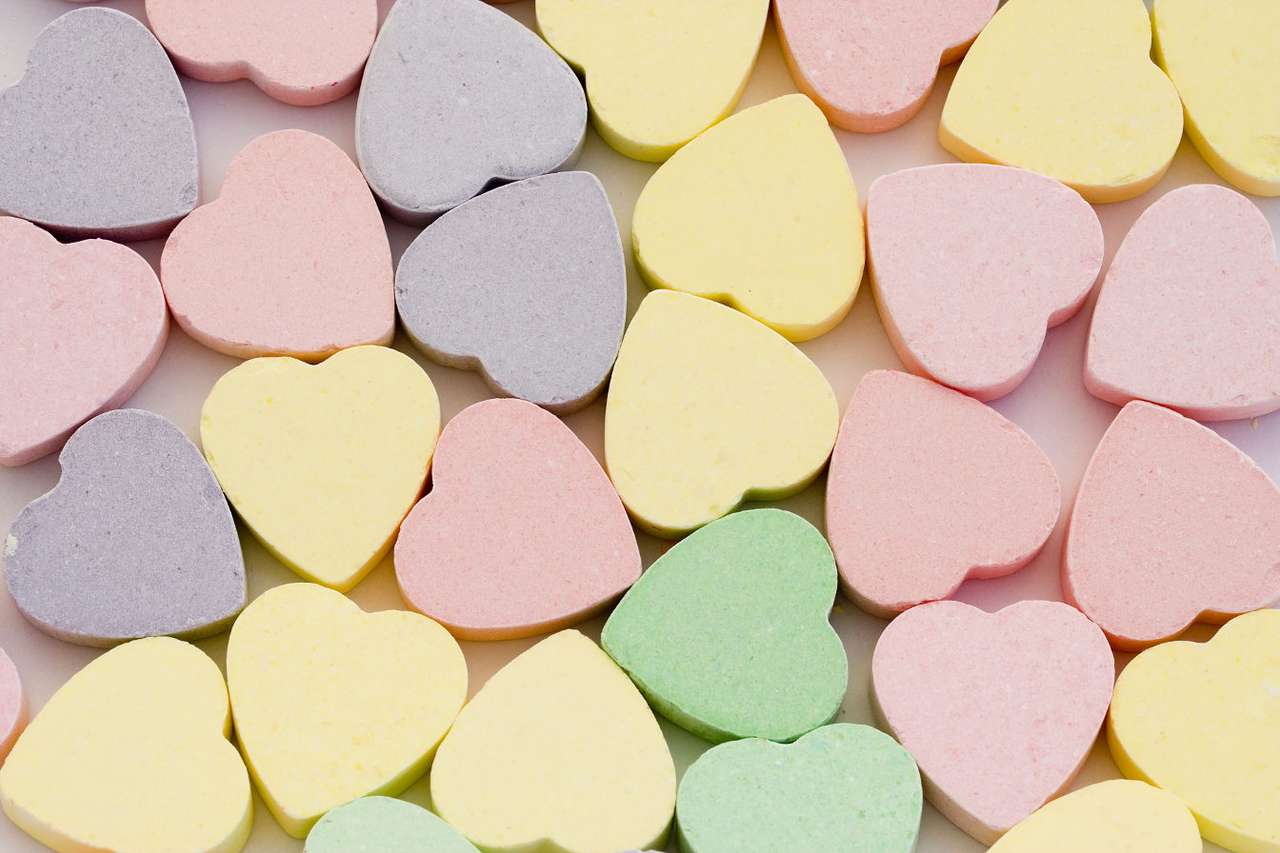 Heart-shaped candies puzzle online from photo