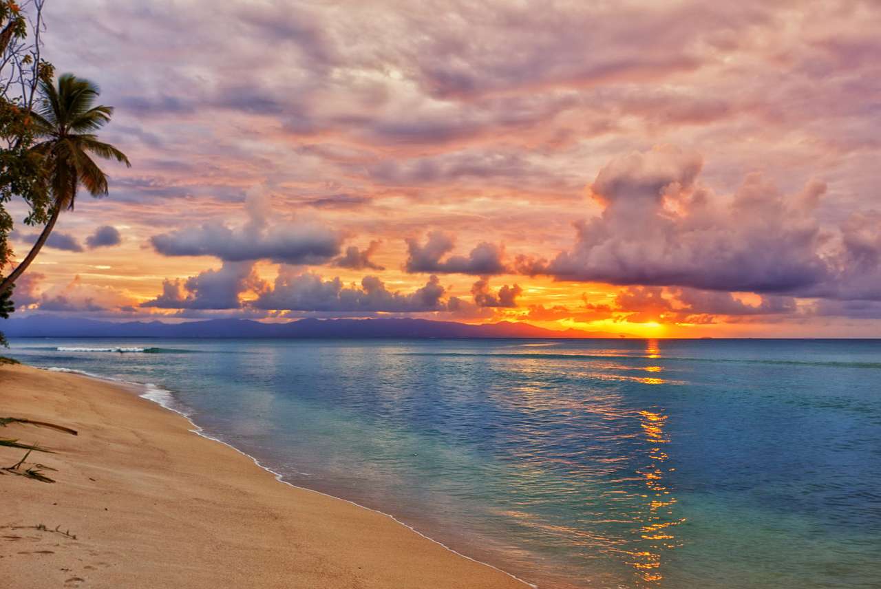 Apus de soare pe plajă puzzle online din fotografie