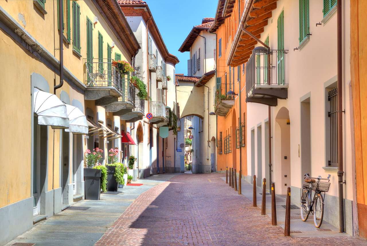 Narrow street in the city of Alba (Italy) puzzle online from photo