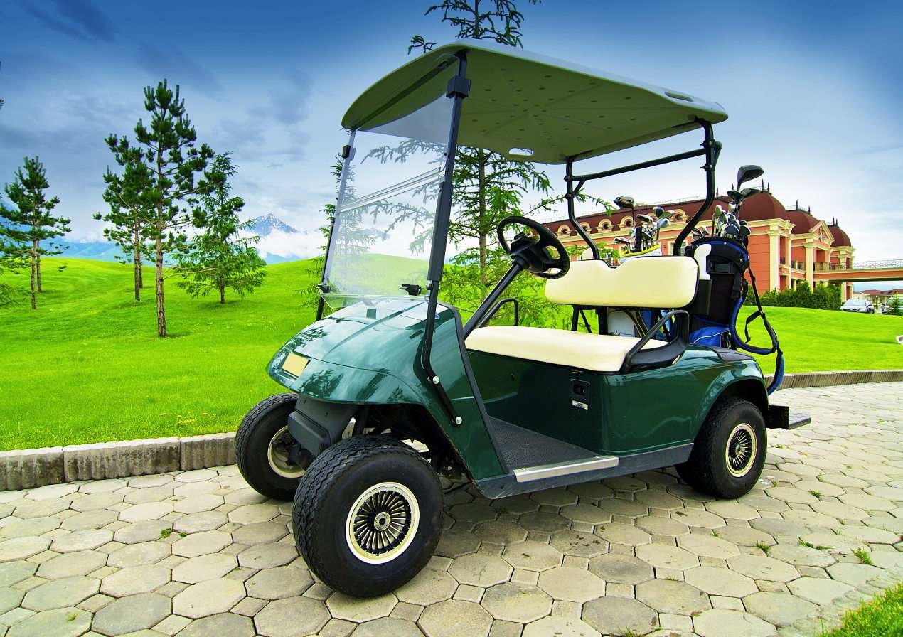 Carrinho de golfe verde escuro puzzle online a partir de fotografia