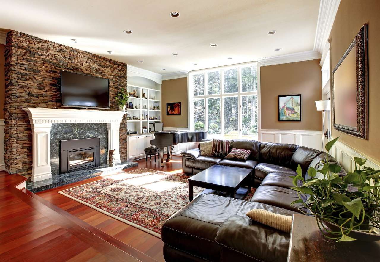 Obývací pokoj s krbem a koženými pohovkami puzzle online z fotografie