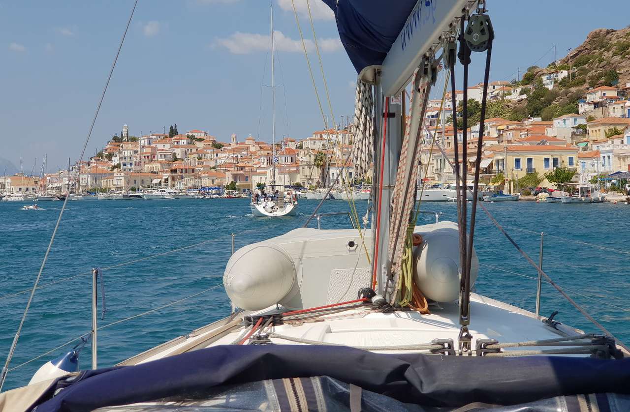 Yacht entering the marina in Poros (Greece) online puzzle