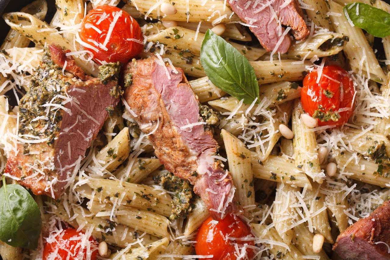 Penne pasta with meat, tomatoes and cheese puzzle online from photo