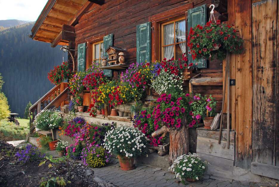Haus mit Blumen pussel online från foto