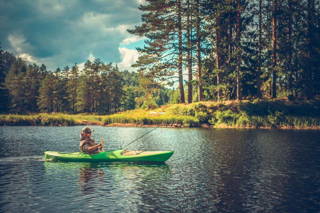 Un uomo in un kayak puzzle online da foto