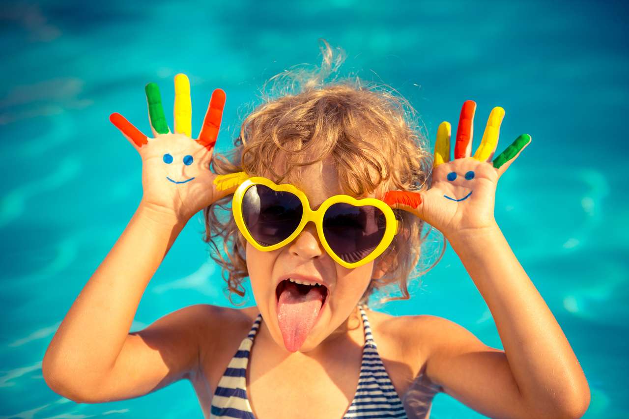 Funny child in swimming pool puzzle online from photo