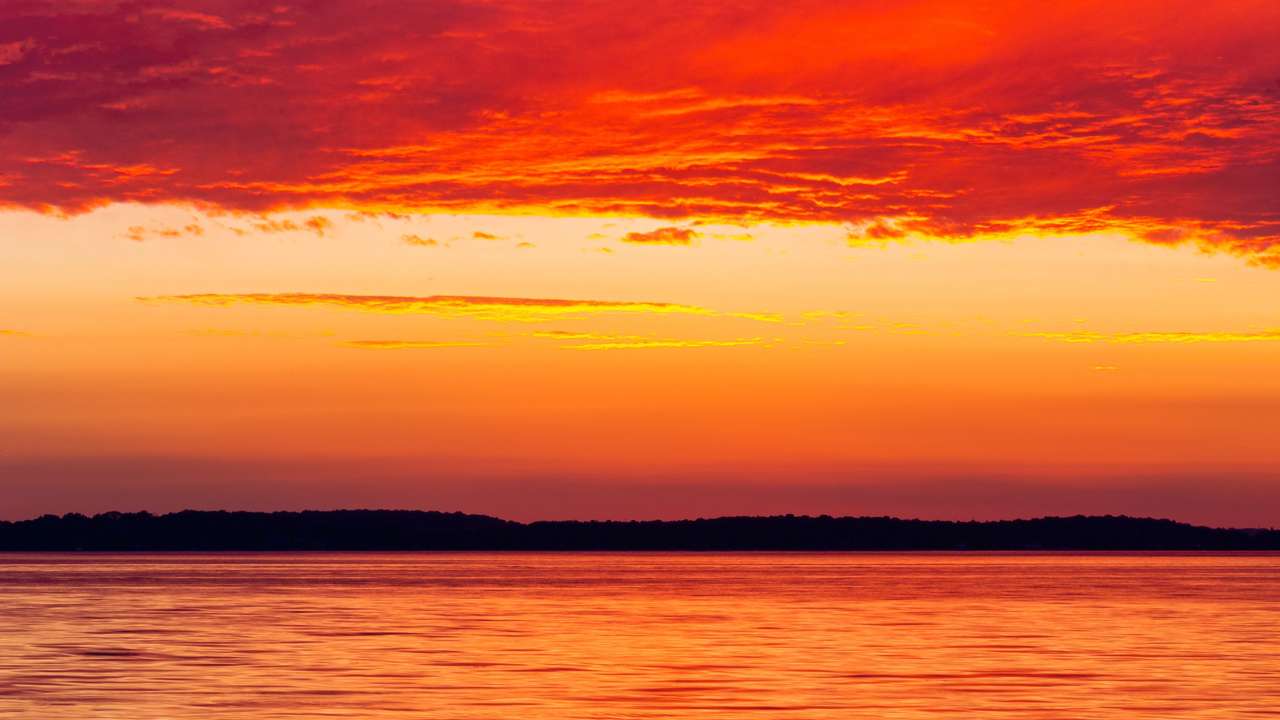 Zonsondergang oranje puzzel online van foto
