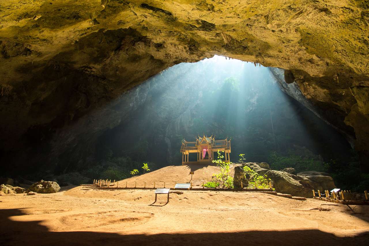 Golden buddhist pavilion in wild cave, Thailand puzzle online from photo