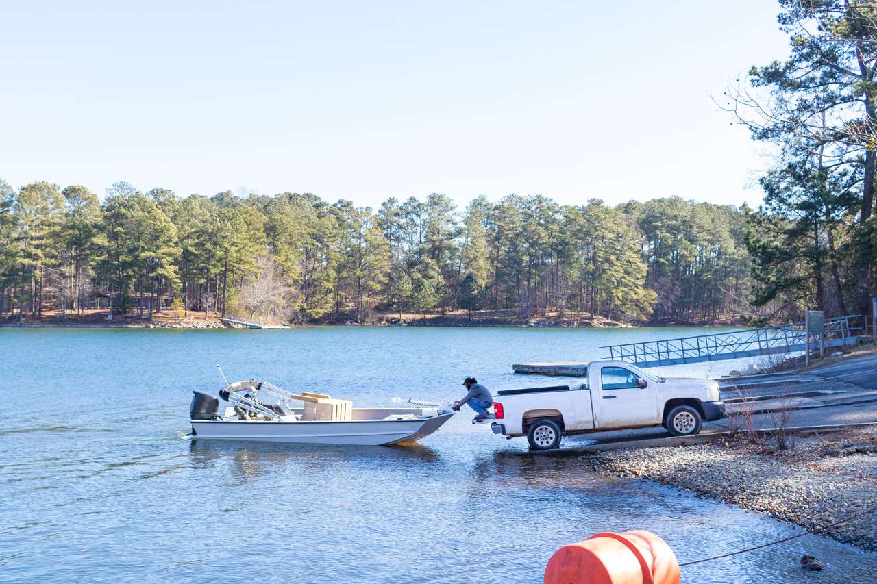 Pickup truck pulling boat puzzle online from photo