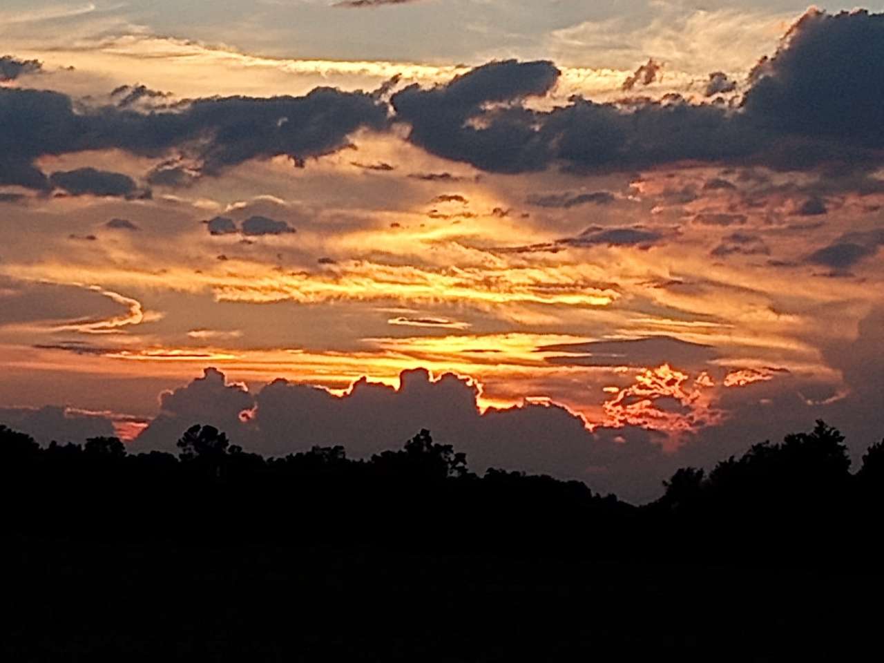 tramonto nuvoloso puzzle online da foto