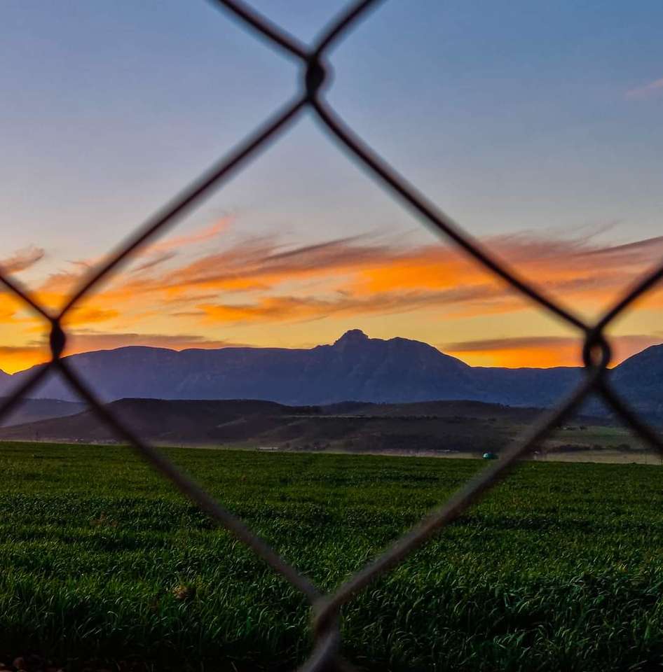 Захід сонця і гори скласти пазл онлайн з фото