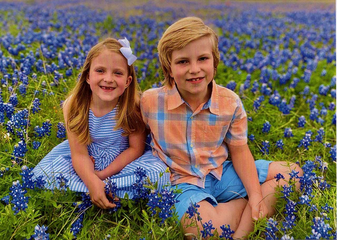 Kids among flowers puzzle online from photo