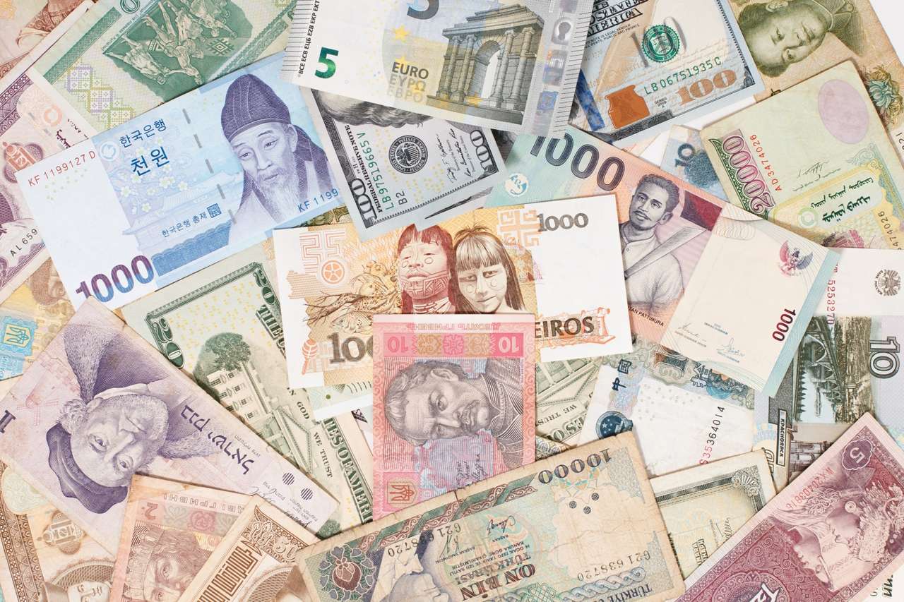 Lots of different currencies puzzle online from photo