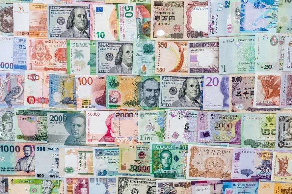 Currencies, lots of them puzzle online from photo