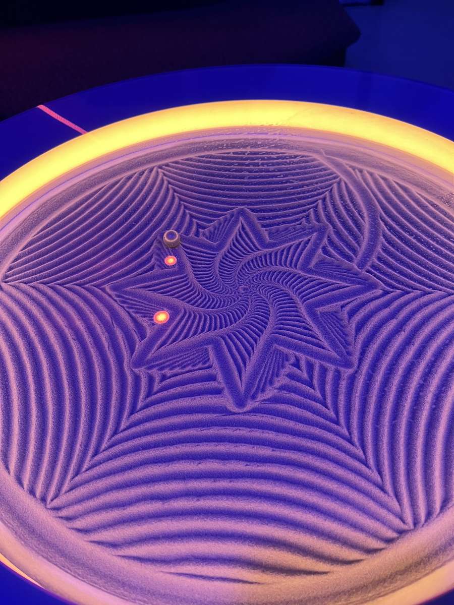 Symmetrisches Muster im Sand Online-Puzzle